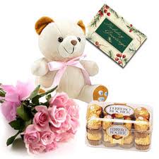 Bunch of Flowers with a half Kg. cake, teddy bear and a box of 16 pcs. Fererro Rocher Chocolates