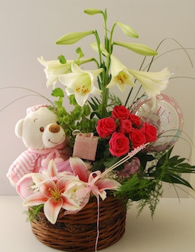Teddy in Basket of Red and white Flowers